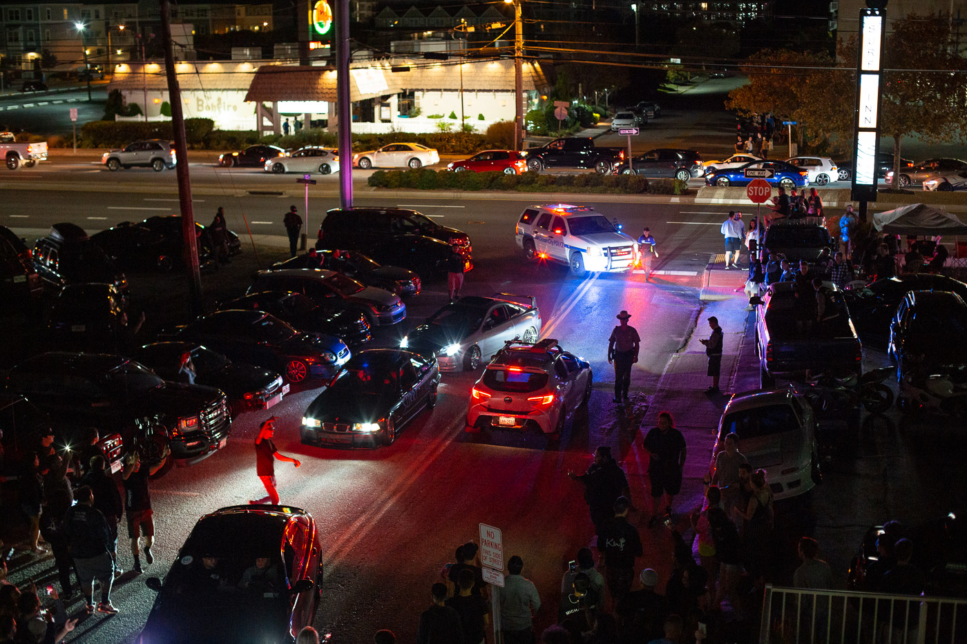 Police busting a crowd on 73rd street after several cars performed burnouts while being egged on by pedestrians