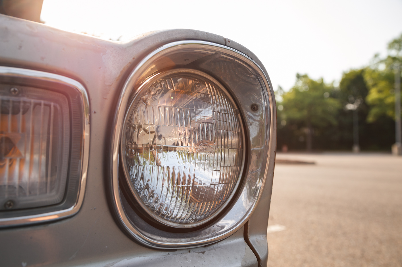 The headlights on this car do not match, and I believe that this is the aftermarket one out of the two. I shouldn't be surprised that Toshiba once made sealed beam headlights.